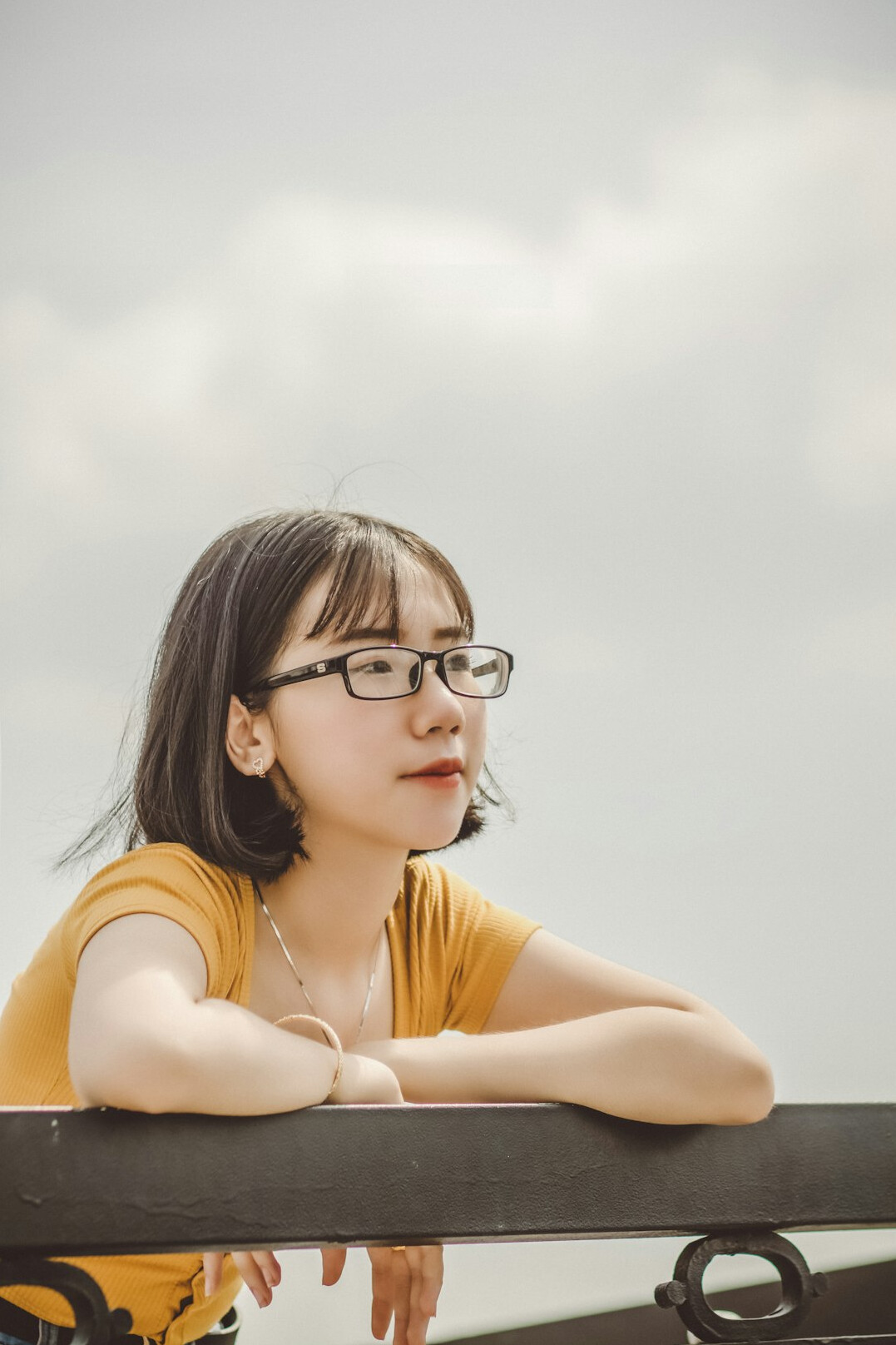 Portrait of a young woman with glasses smiling