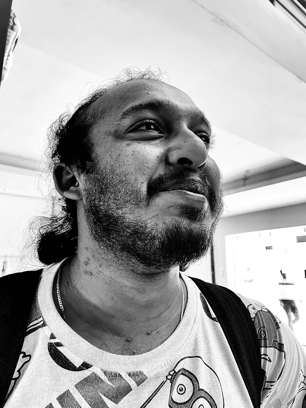 Portrait of a man with a beard smiling