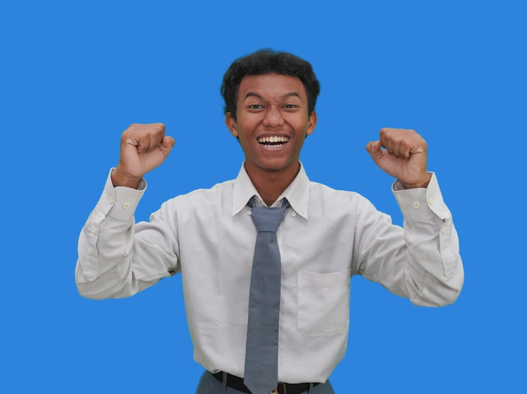 person celebrating coding achievement