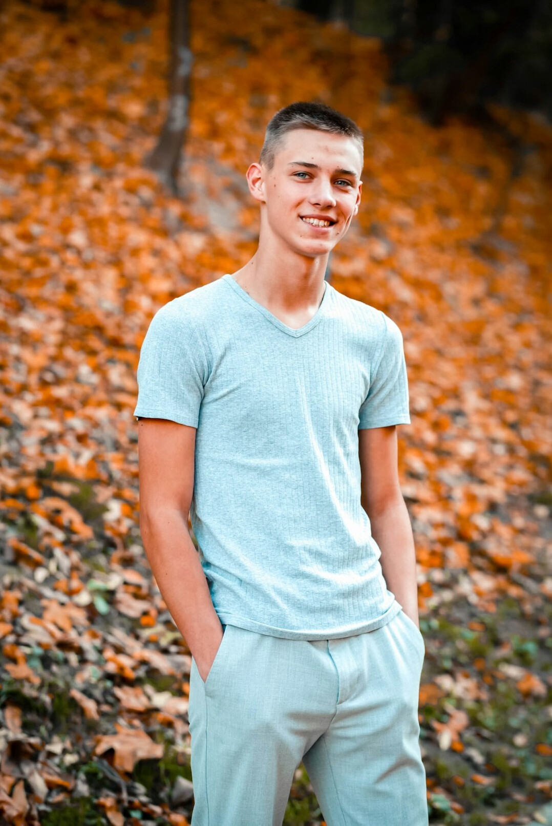 Portrait of a young man with short hair smiling