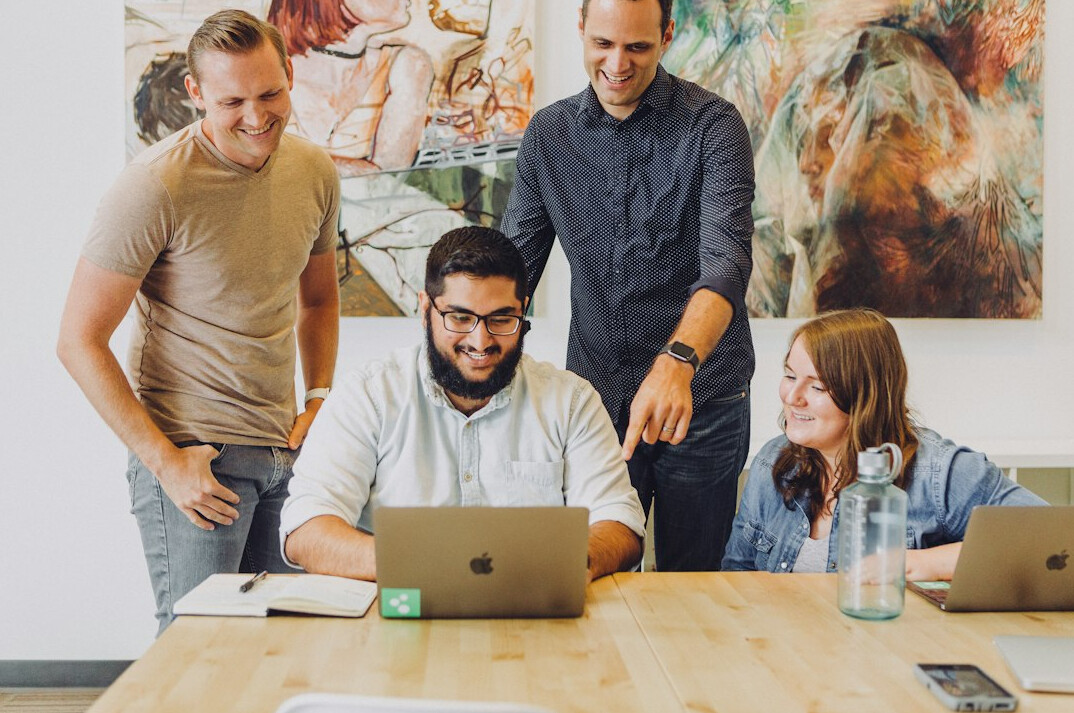 group of coders collaborating