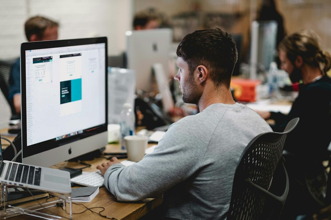 young man learning web development