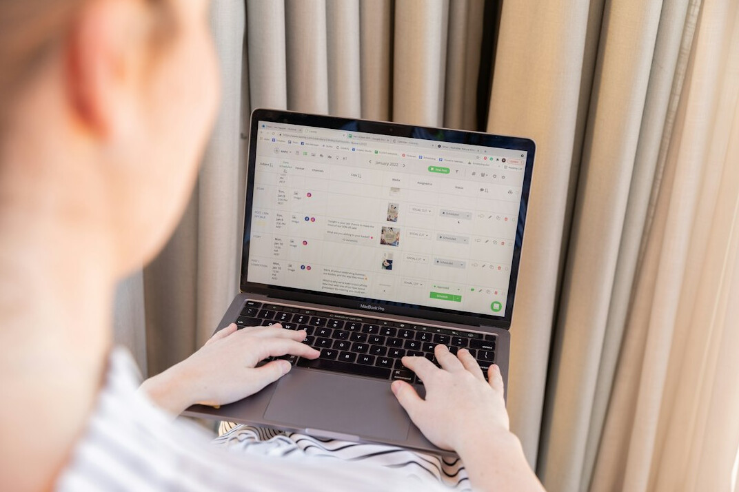 woman coding on laptop